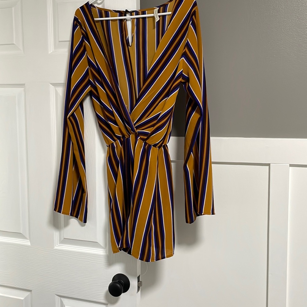 Slightly worn romper. Peppermint brand size large.
